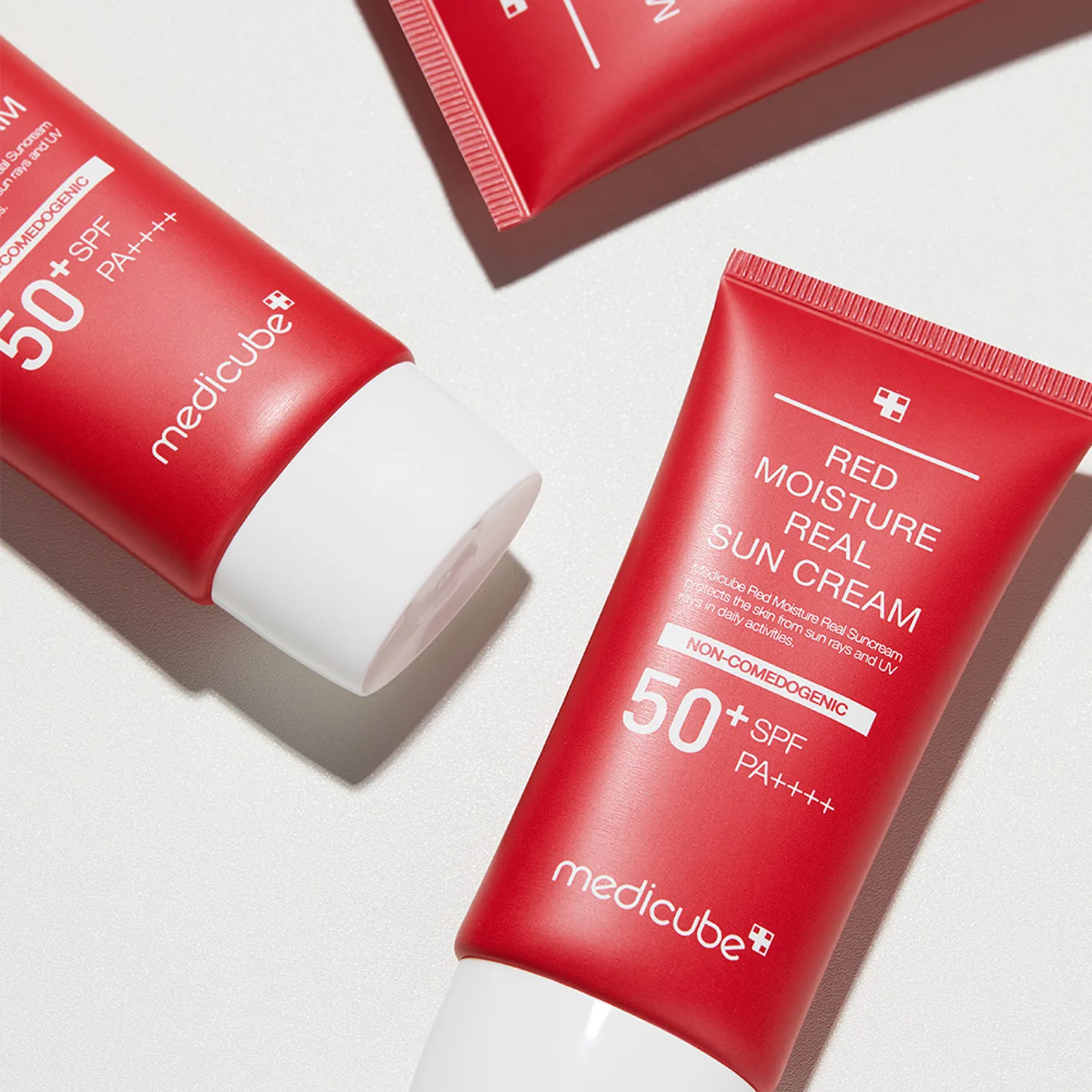 Medicube Red Moisture Real Sun Cream SPF50+ available on Qasr Jamal Store