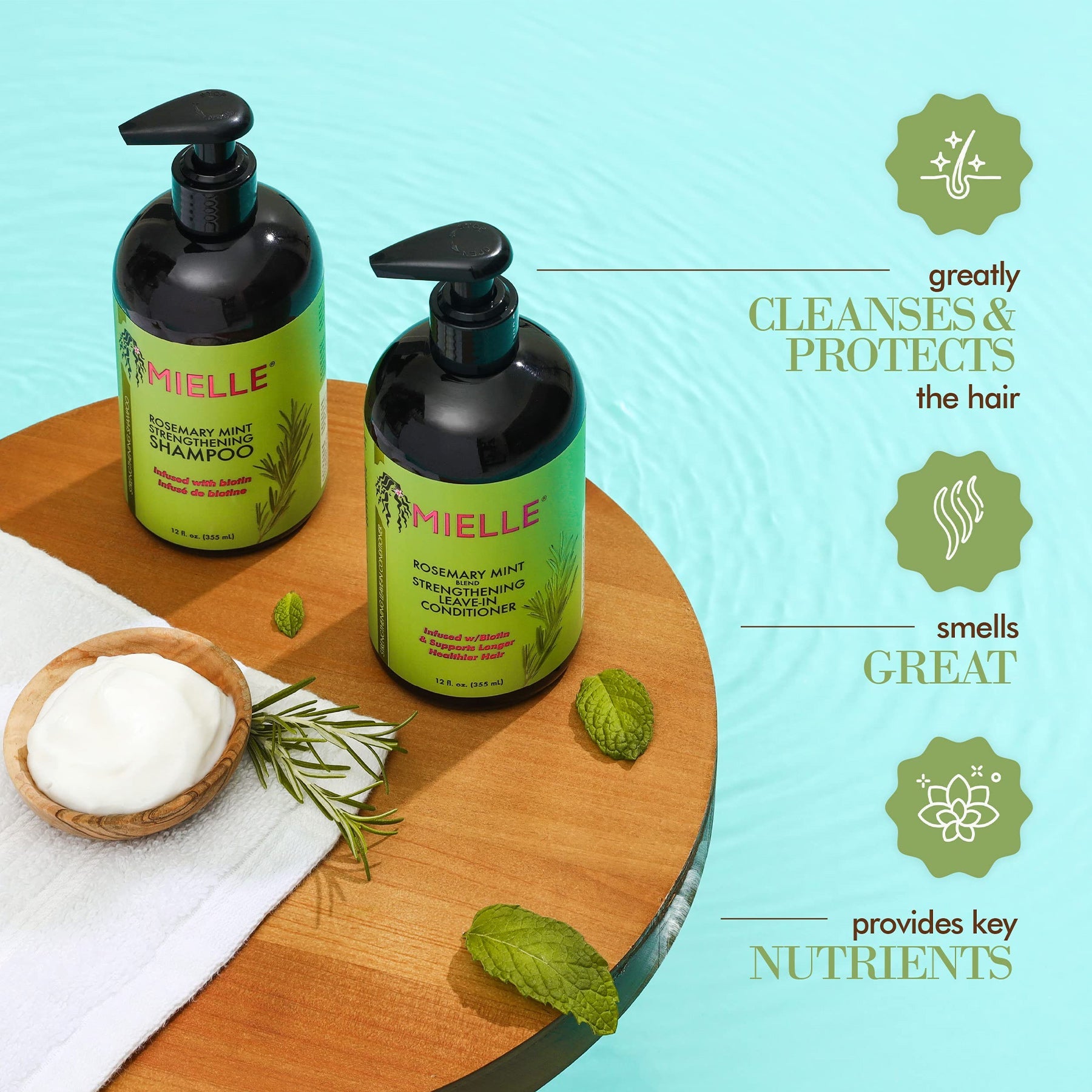 Bottle of Mielle Rosemary Mint Strengthening Shampoo - 355ml, enriched with biotin and organic oils, on a sky blue background.